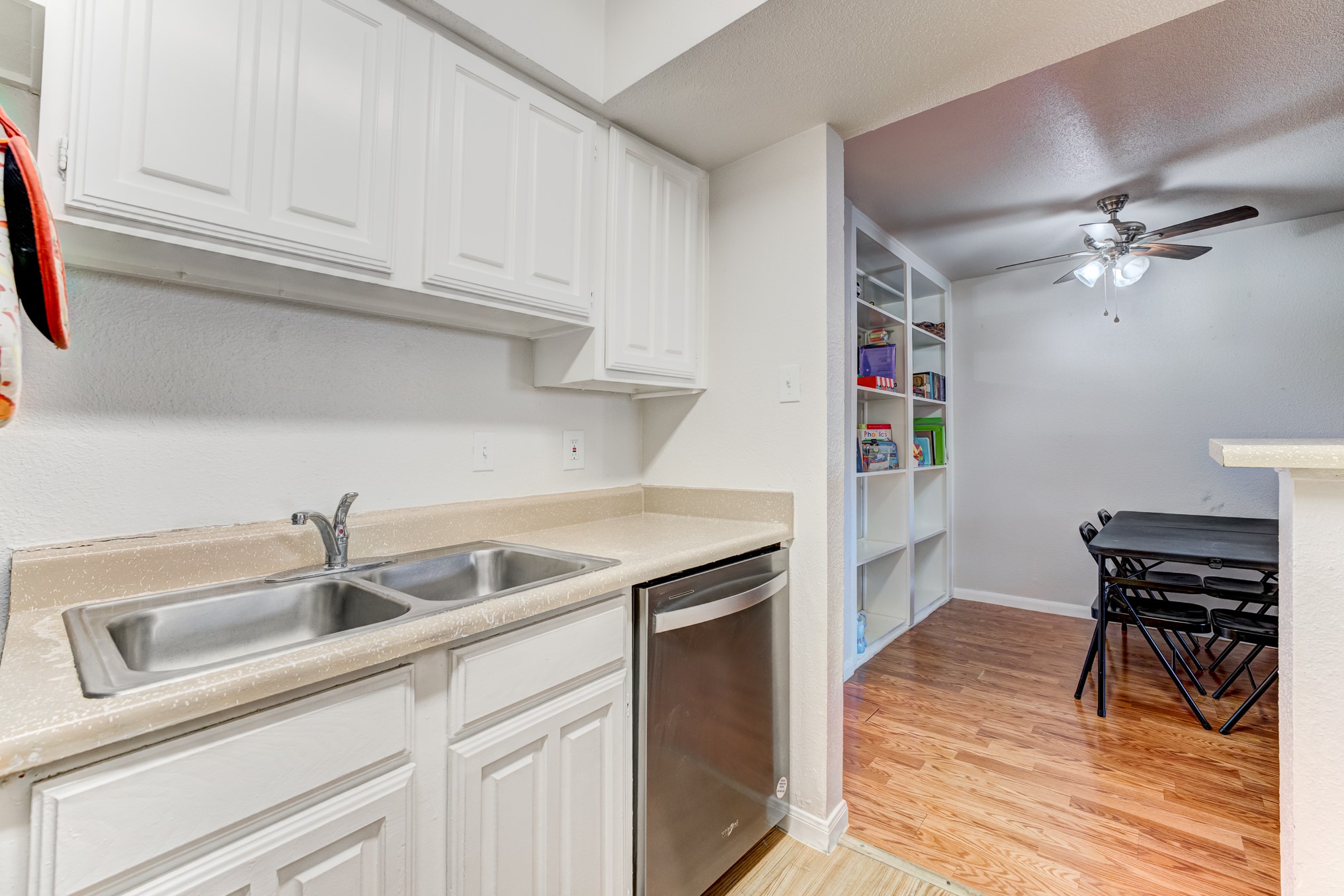 6001 Reims Road, Unit 301 Houston, TX 77036 - Photo 17 of 29 a kitchen with stainless steel appliances granite countertop a sink and cabinets