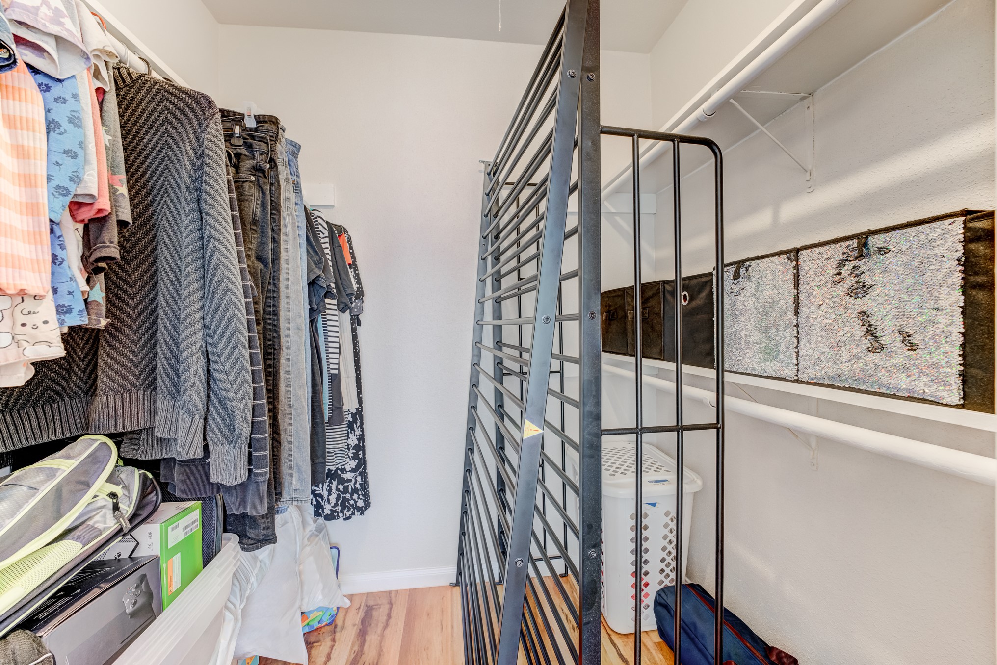 6001 Reims Road, Unit 301 Houston, TX 77036 - Photo 22 of 29 a view of walk in closet with clothes and shoes