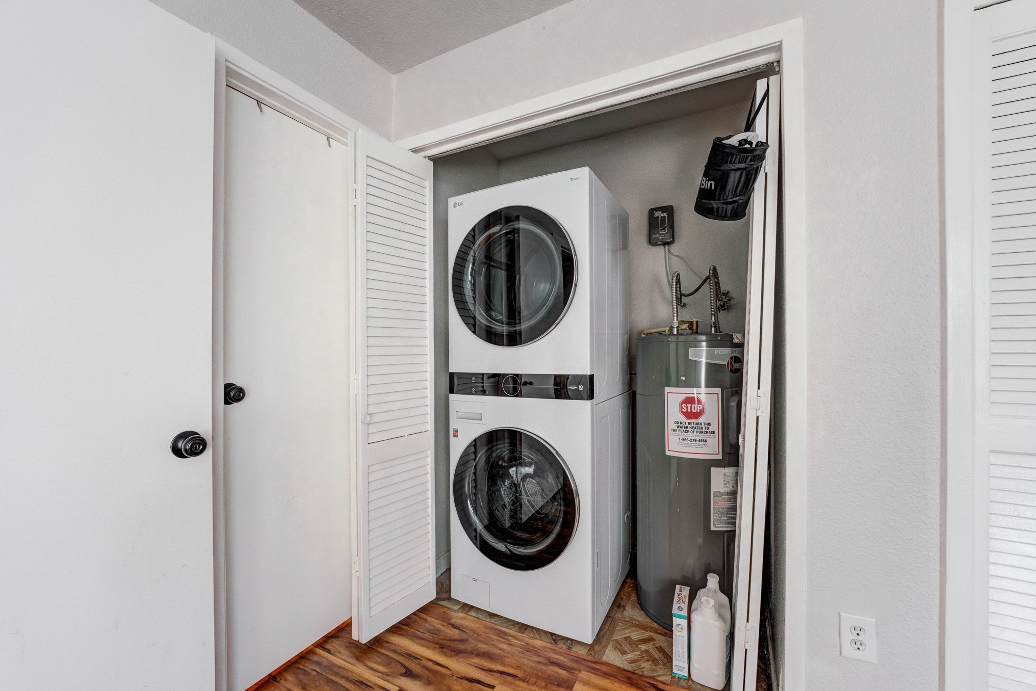 6001 Reims Road, Unit 301 Houston, TX 77036 - Photo 23 of 29 a utility room with dryer and washer