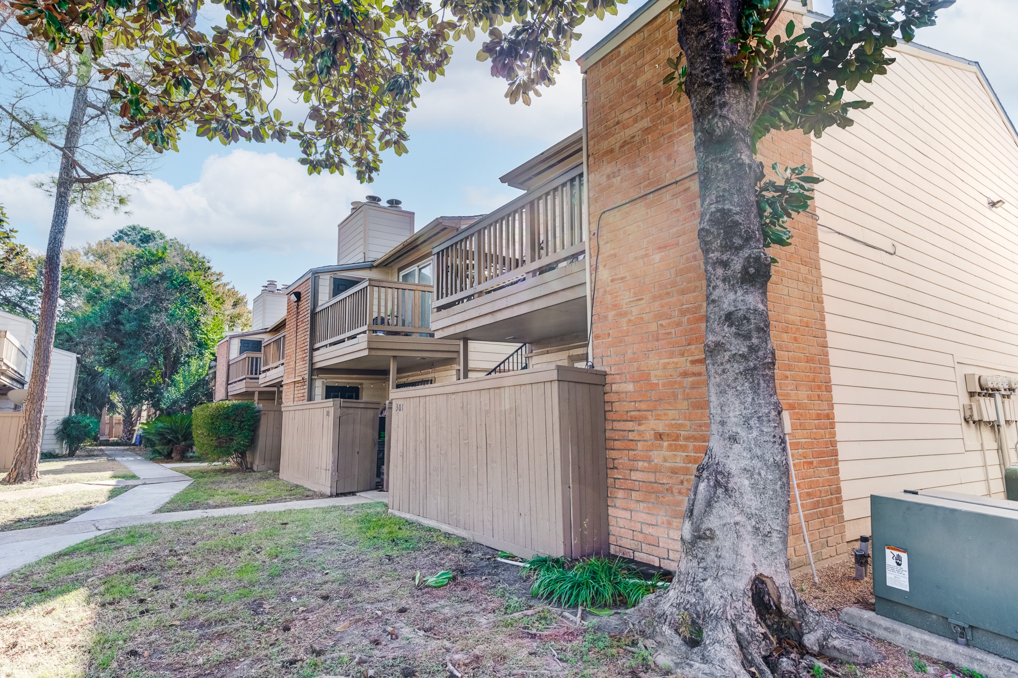 6001 Reims Road, Unit 301 Houston, TX 77036 - Photo 28 of 29 a view of a house with a yard