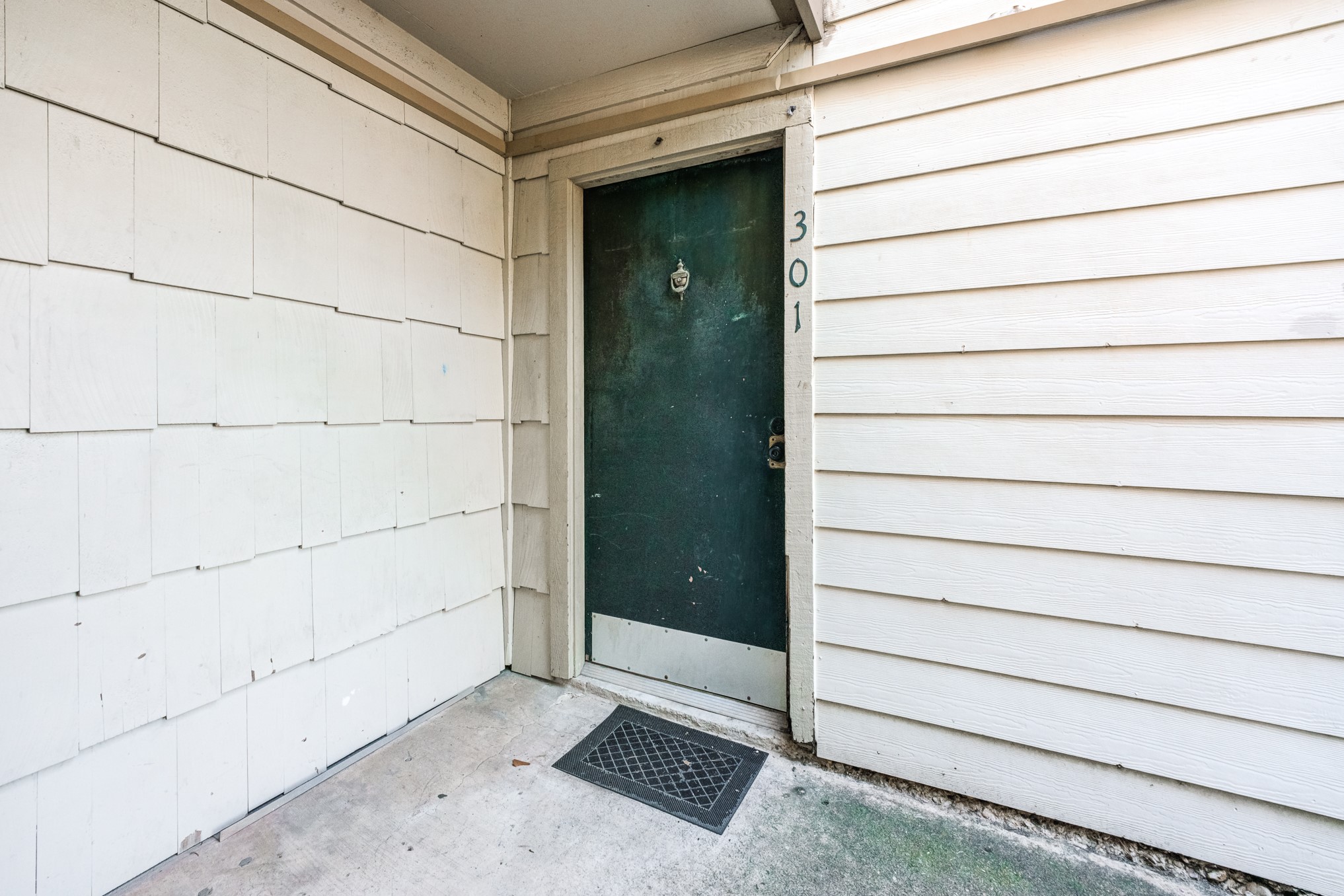 6001 Reims Road, Unit 301 Houston, TX 77036 - Photo 5 of 29 a view of wooden door