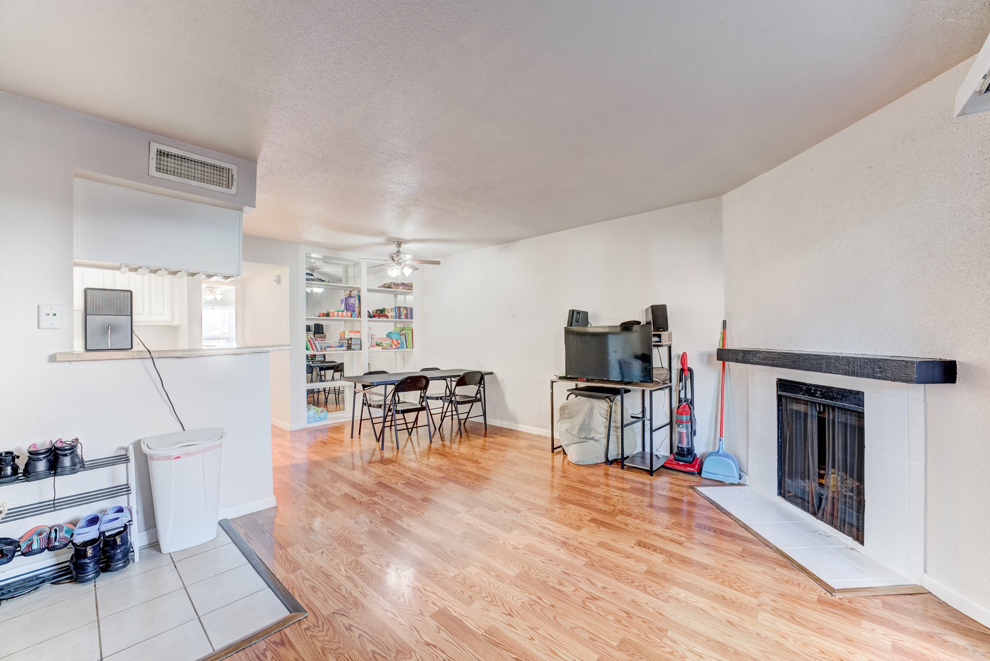 6001 Reims Road, Unit 301 Houston, TX 77036 - Photo 6 of 29 a living room with furniture and a wooden floor