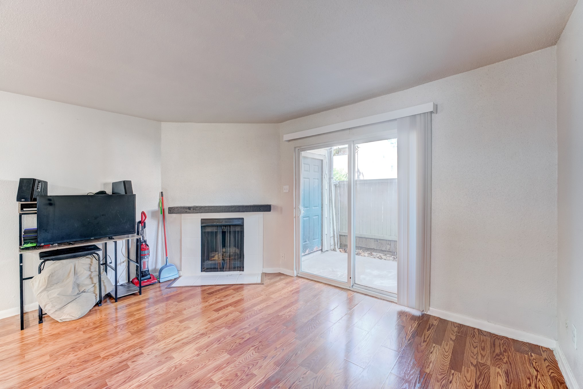 6001 Reims Road, Unit 301 Houston, TX 77036 - Photo 7 of 29 a view of an empty room with a fireplace and a window