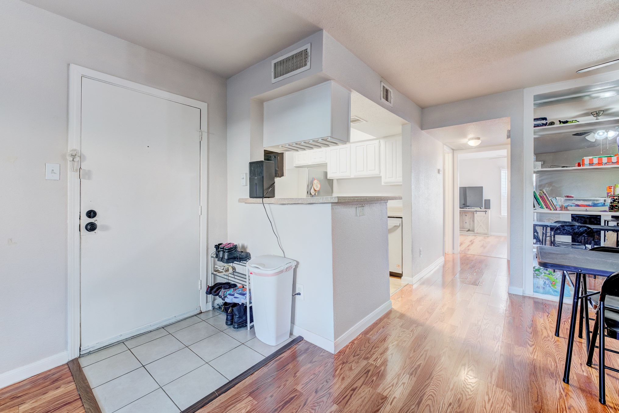 6001 Reims Road, Unit 301 Houston, TX 77036 - Photo 10 of 29 a view of a kitchen with wooden floor and a sink