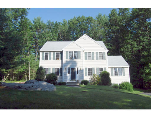 13 Fisher Road Chelmsford, MA 01824 - Photo 1 of 20 a front view of a house with a garden