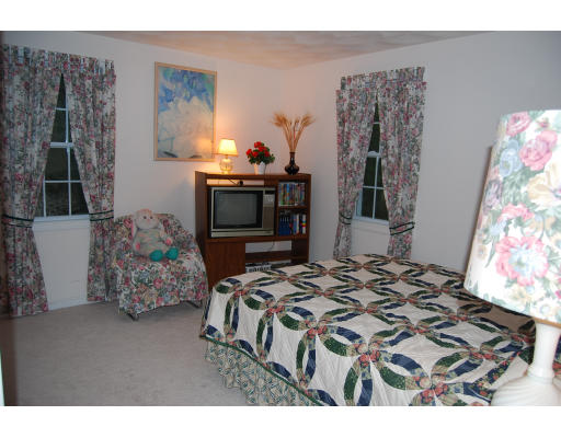 13 Fisher Road Chelmsford, MA 01824 - Photo 13 of 20 a bedroom with bed and a window