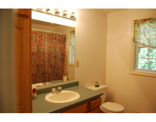 13 Fisher Road Chelmsford, MA 01824 - Photo 15 of 20 a bathroom with a granite countertop sink and a mirror