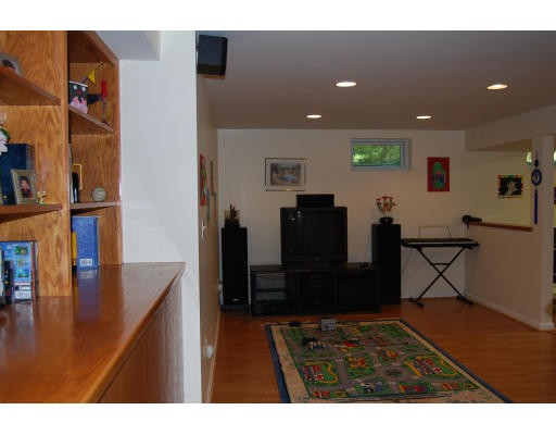13 Fisher Road Chelmsford, MA 01824 - Photo 18 of 20 a living room with furniture and a flat screen tv