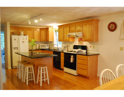 13 Fisher Road Chelmsford, MA 01824 - Photo 3 of 20 a kitchen with stainless steel appliances granite countertop a sink a stove and a refrigerator