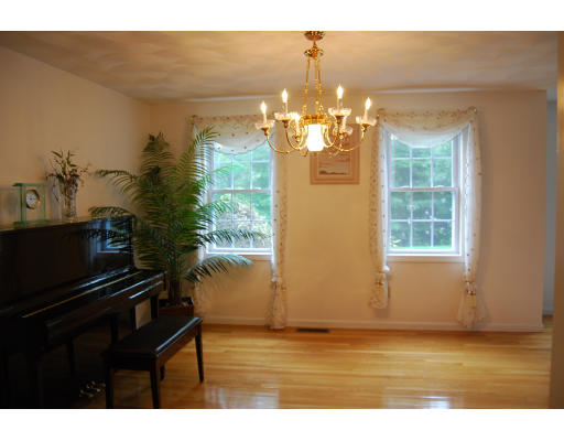13 Fisher Road Chelmsford, MA 01824 - Photo 7 of 20 a view of a livingroom with furniture and chandelier