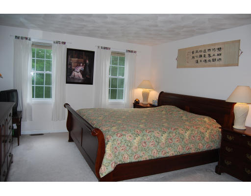 13 Fisher Road Chelmsford, MA 01824 - Photo 9 of 20 a bed sitting in a bedroom next to a window