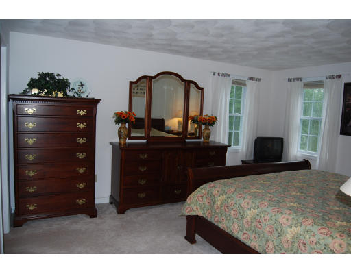 13 Fisher Road Chelmsford, MA 01824 - Photo 10 of 20 a bedroom with a bed and a dresser