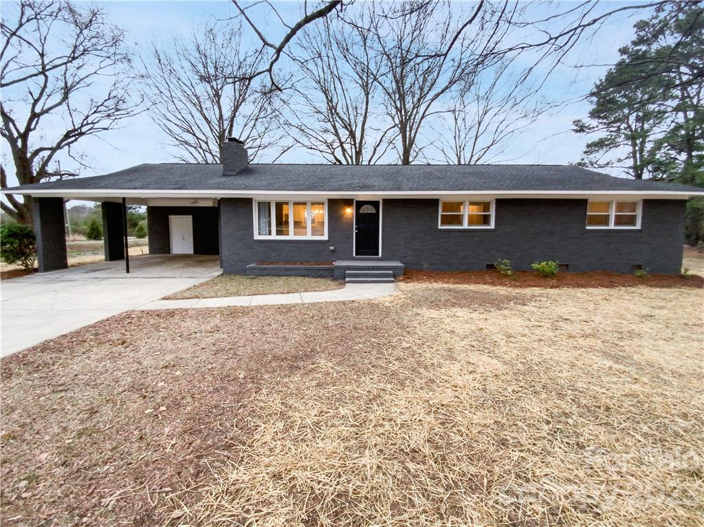 3020 Potter Road Waxhaw, NC 28173 - Photo 1 of 17 front view of a house with a yard