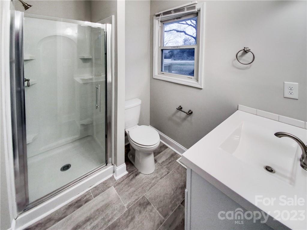 3020 Potter Road Waxhaw, NC 28173 - Photo 14 of 17 a bathroom with a sink and a mirror