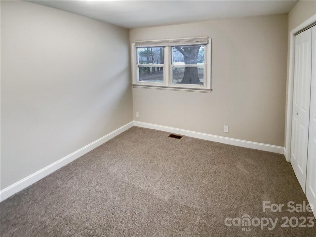 3020 Potter Road Waxhaw, NC 28173 - Photo 8 of 17 an empty room with windows