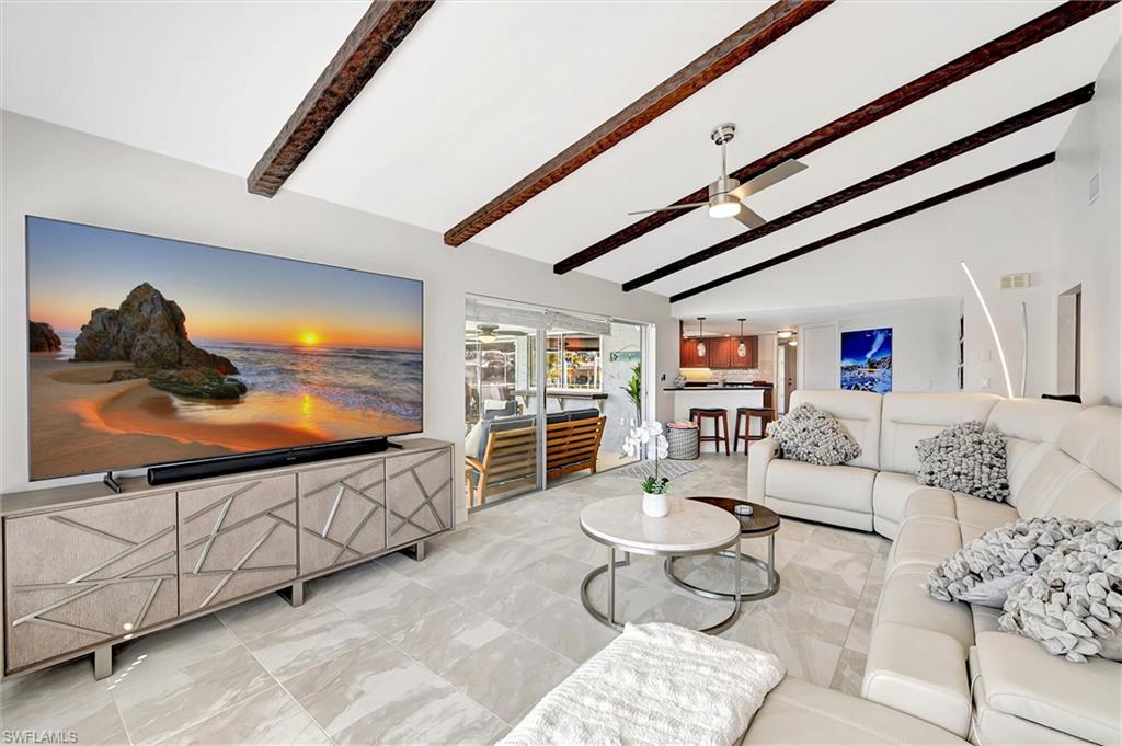 69 Ocean Drive Punta Gorda, FL 33950 - Photo 15 of 44 a living room with furniture and a flat screen tv
