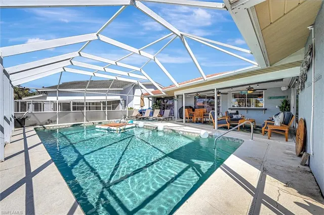 a view of a backyard with sitting area
