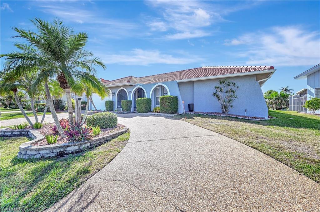 69 Ocean Drive Punta Gorda, FL 33950 - Photo 2 of 44 a house view with a garden space
