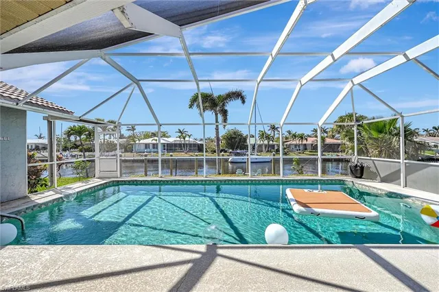 a view of a swimming pool with a patio