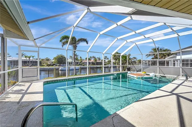 a view of a swimming pool with a patio
