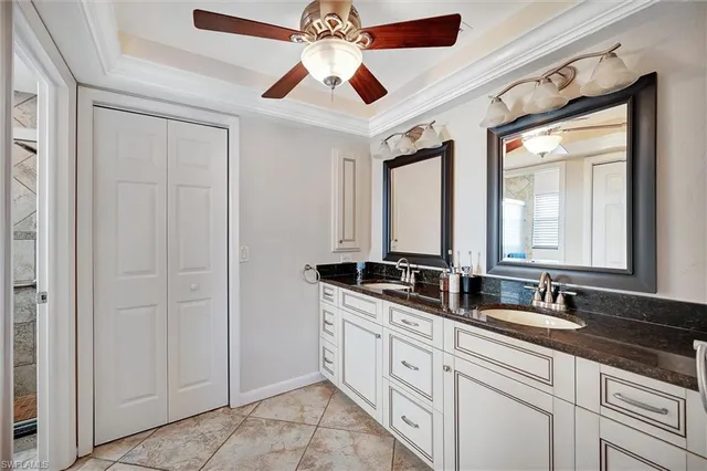 a bathroom with 2 sink and a mirror