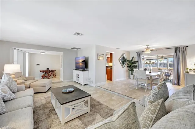 a living room with furniture and a table