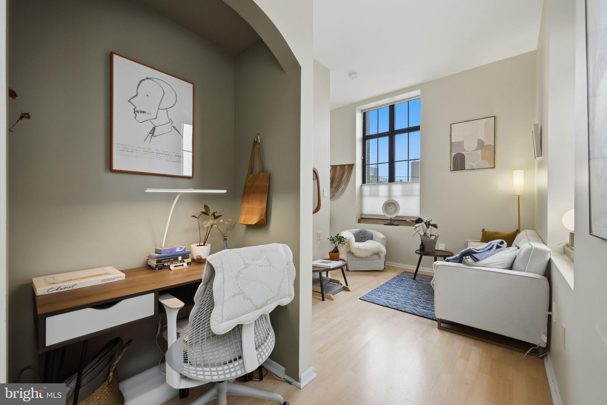 1601 Spring Garden Street, Unit 207 Philadelphia, PA 19130 - Photo 17 of 20 a living room with furniture and wooden floor