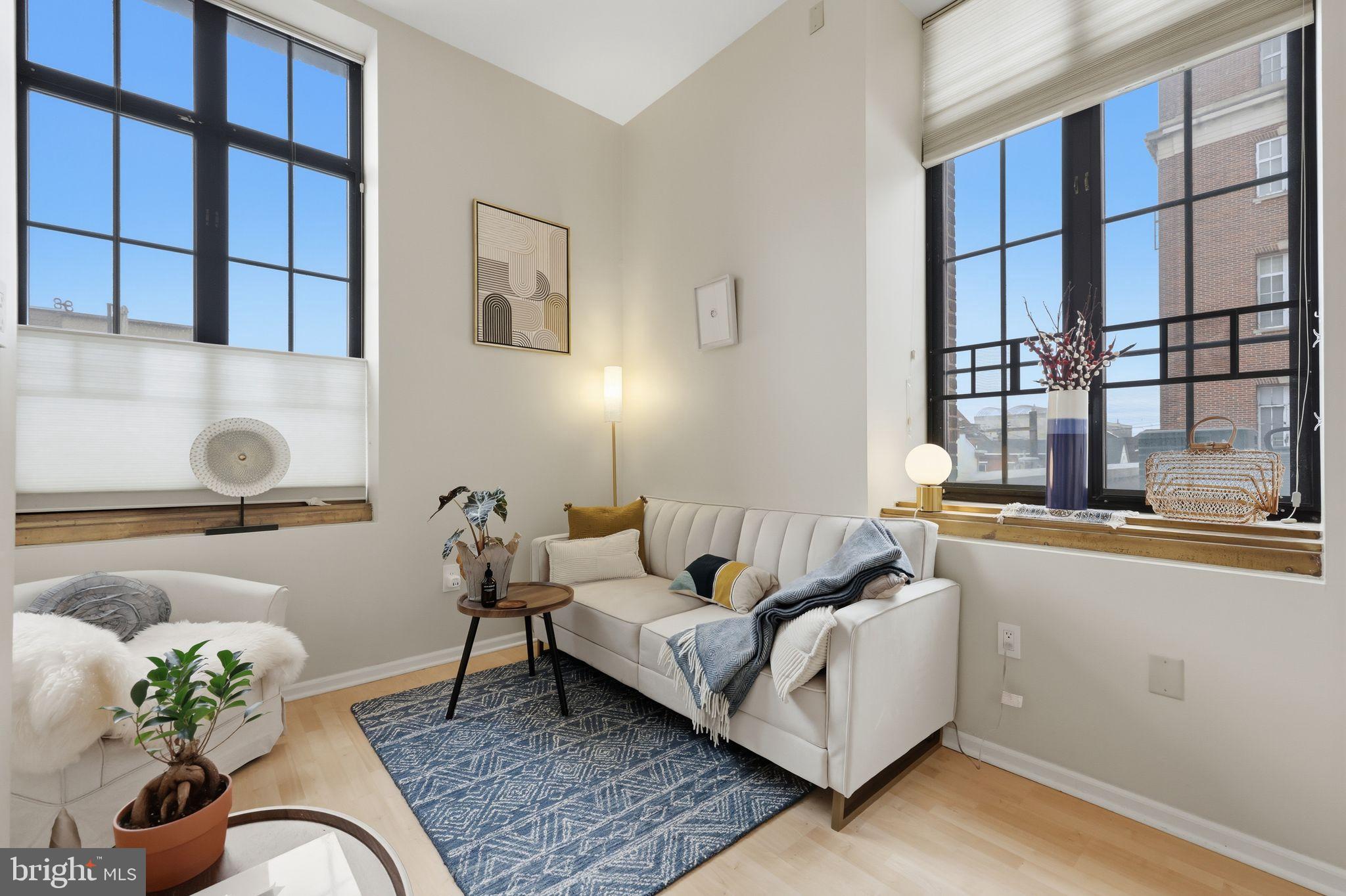 1601 Spring Garden Street, Unit 207 Philadelphia, PA 19130 - Photo 2 of 20 a living room with furniture and a window