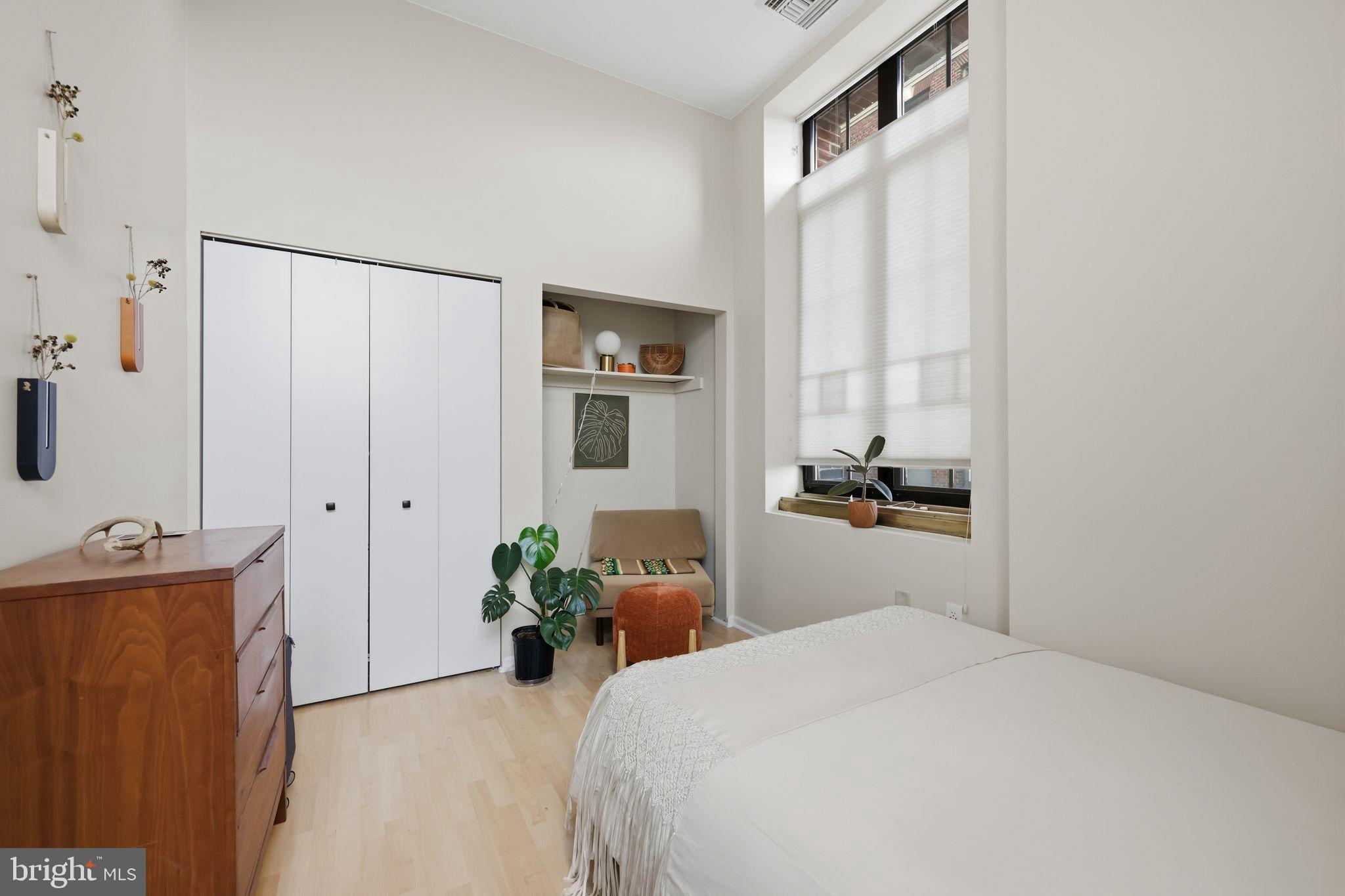 1601 Spring Garden Street, Unit 207 Philadelphia, PA 19130 - Photo 7 of 20 a bedroom with a bed and a dresser