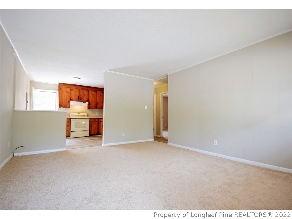 1308 King Street, Unit A Spring Lake, NC 28390 - Photo 2 of 11 a view of a big room with wooden floor and windows