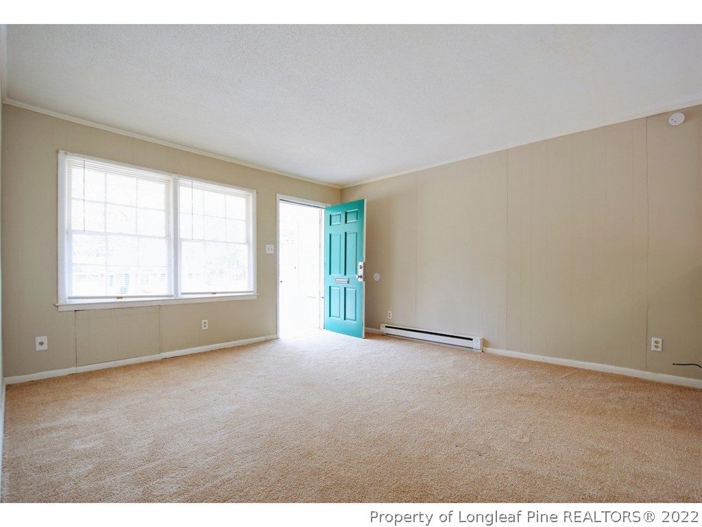 1308 King Street, Unit A Spring Lake, NC 28390 - Photo 3 of 11 an empty room with windows