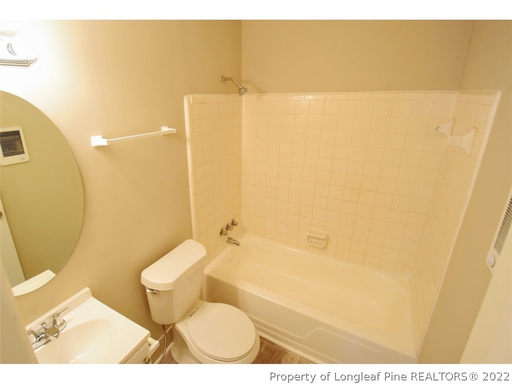 1308 King Street, Unit A Spring Lake, NC 28390 - Photo 6 of 11 a bathroom with a toilet and sink