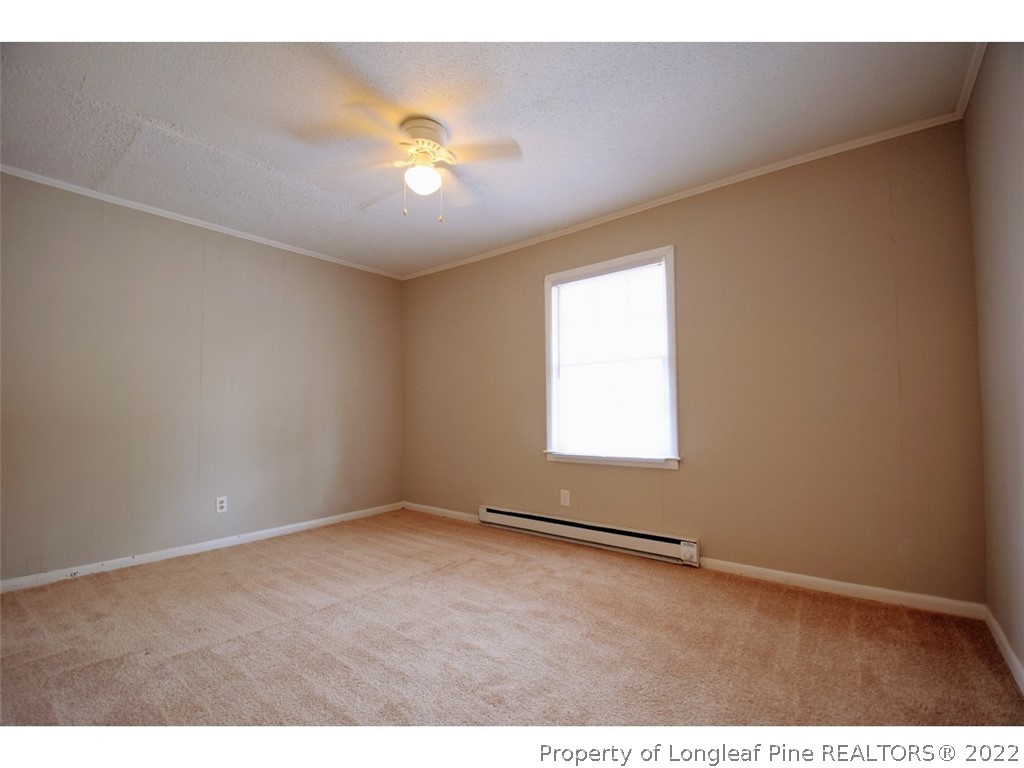1308 King Street, Unit A Spring Lake, NC 28390 - Photo 7 of 11 a view of an empty room with a window