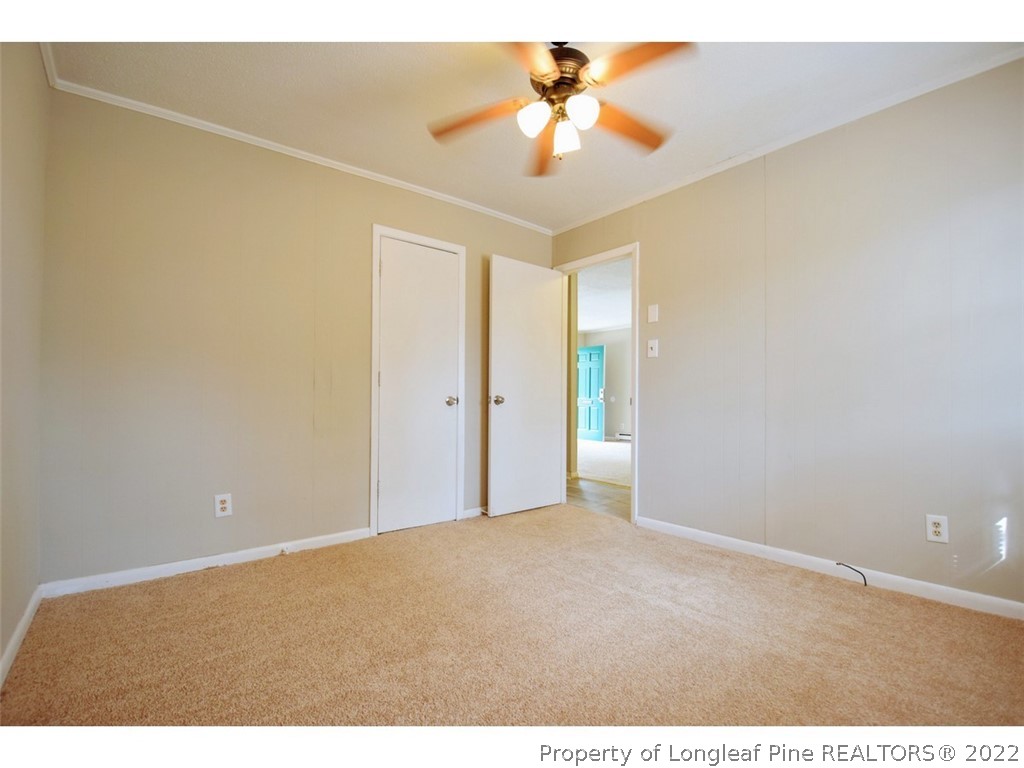 1308 King Street, Unit A Spring Lake, NC 28390 - Photo 10 of 11 a view of empty room with a chandelier fan