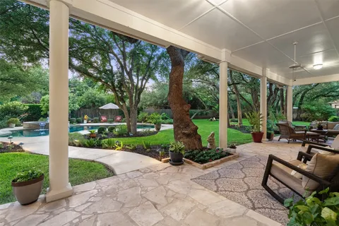 a view of a patio with a chairs and table in a patio