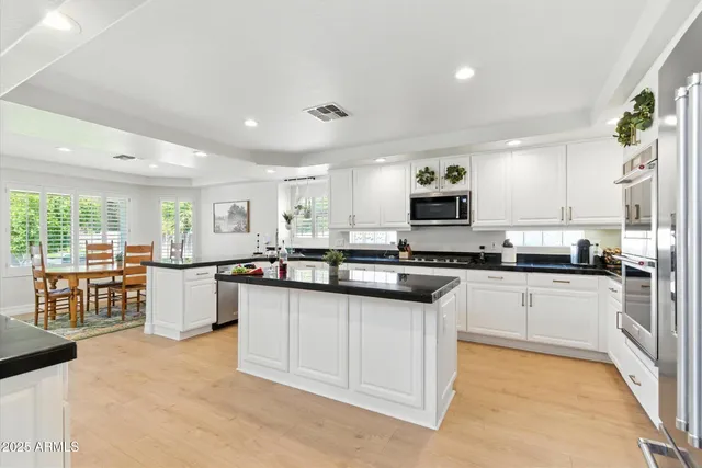 a kitchen with a sink and counter top space