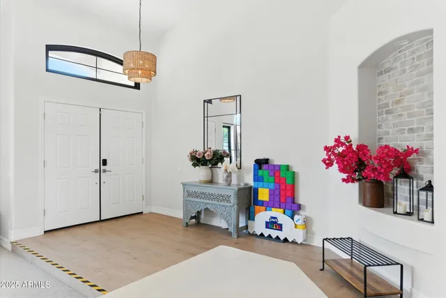 a bedroom with furniture and a baby crib