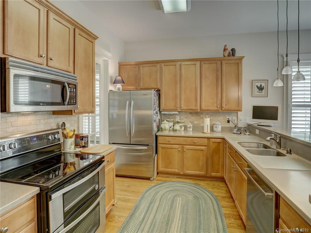 761 Shady Grove Crossing Fort Mill, SC 29708 - Photo 14 of 48 a kitchen with stainless steel appliances a refrigerator sink and microwave