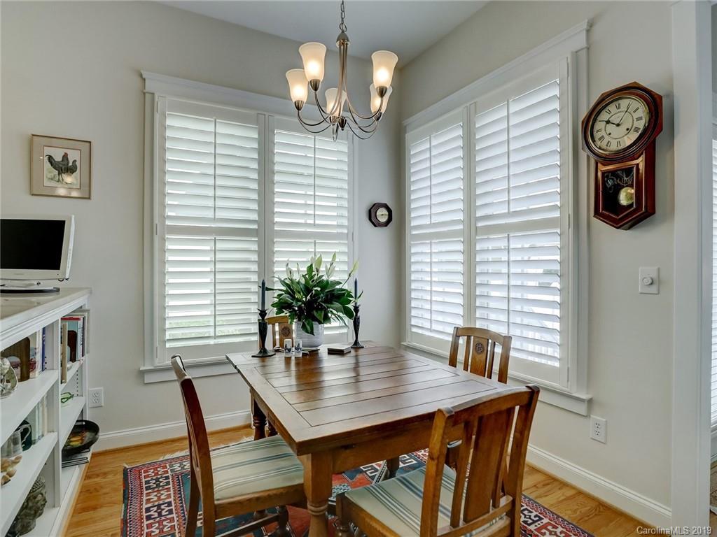 761 Shady Grove Crossing Fort Mill, SC 29708 - Photo 15 of 48 a view of a dining room with furniture and wooden floor