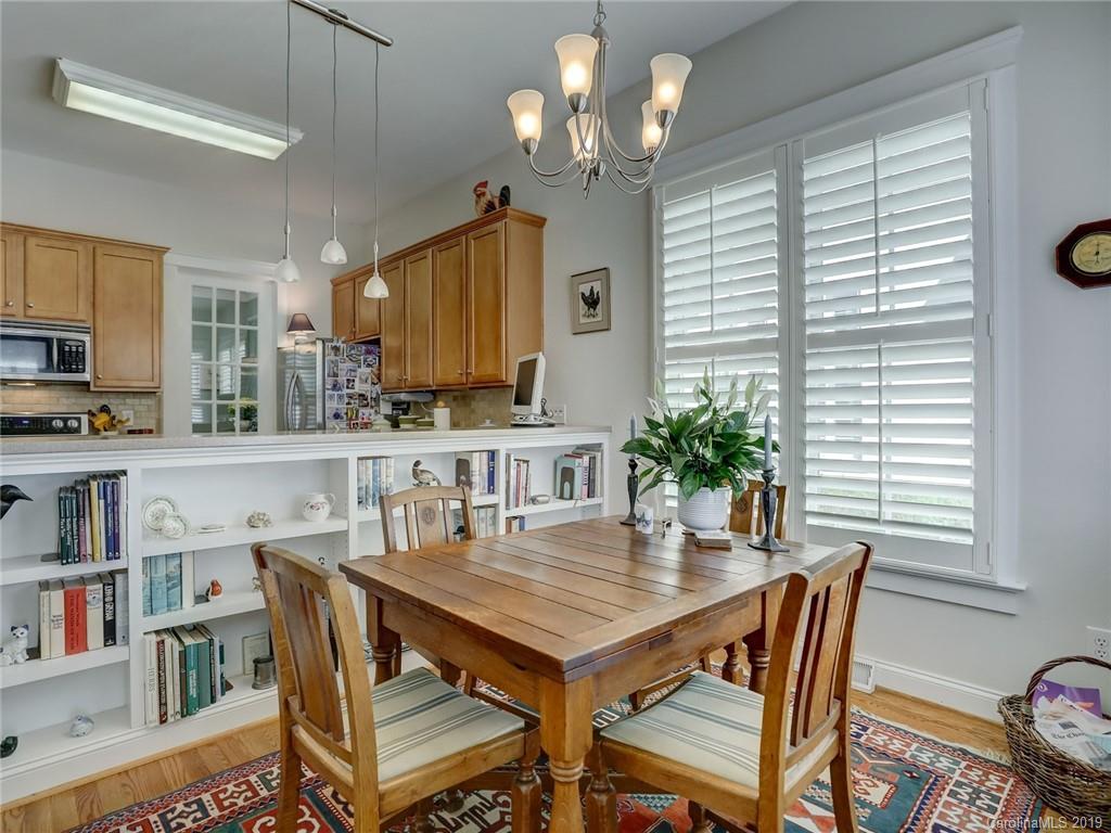 761 Shady Grove Crossing Fort Mill, SC 29708 - Photo 16 of 48 a view of a dining room with furniture and a potted plant