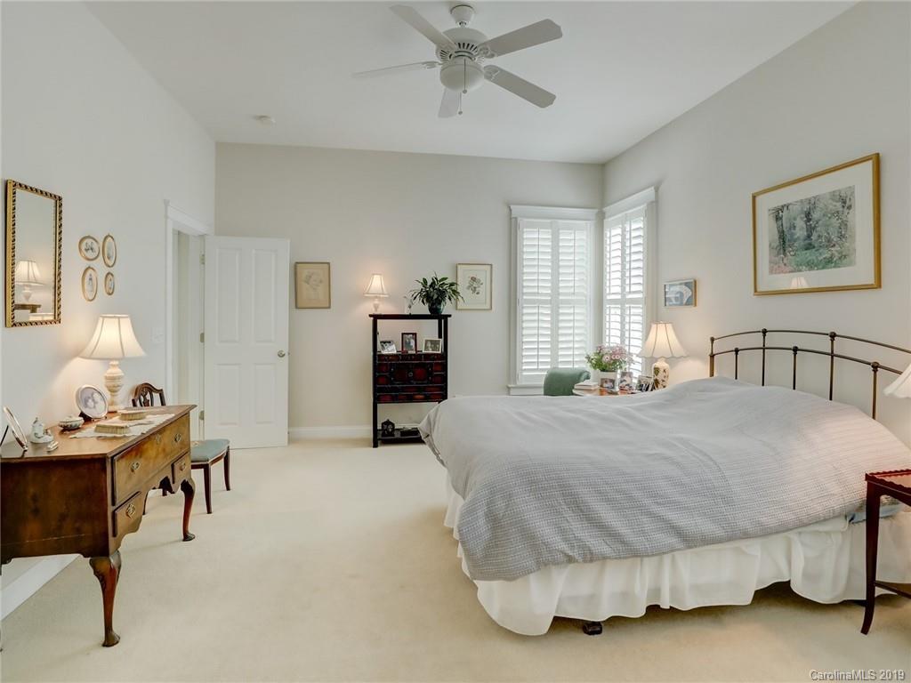 761 Shady Grove Crossing Fort Mill, SC 29708 - Photo 18 of 48 a bedroom with a bed and dresser