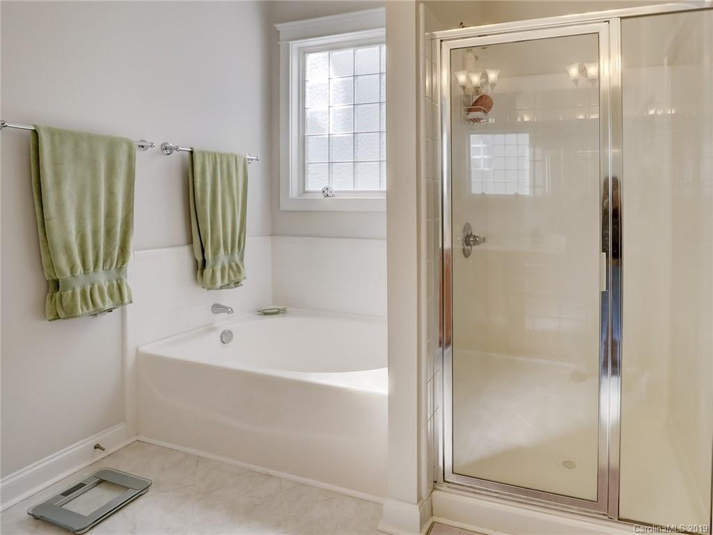 761 Shady Grove Crossing Fort Mill, SC 29708 - Photo 20 of 48 a bathroom with a bathtub and a shower
