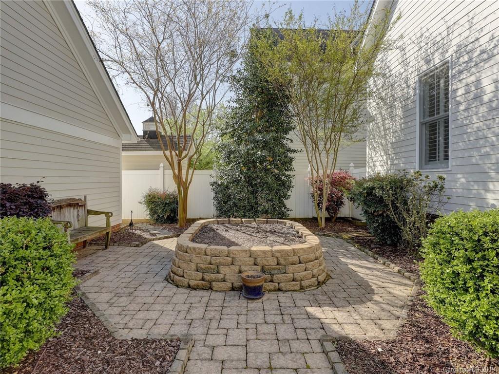 761 Shady Grove Crossing Fort Mill, SC 29708 - Photo 31 of 48 a view of a backyard with table and chairs
