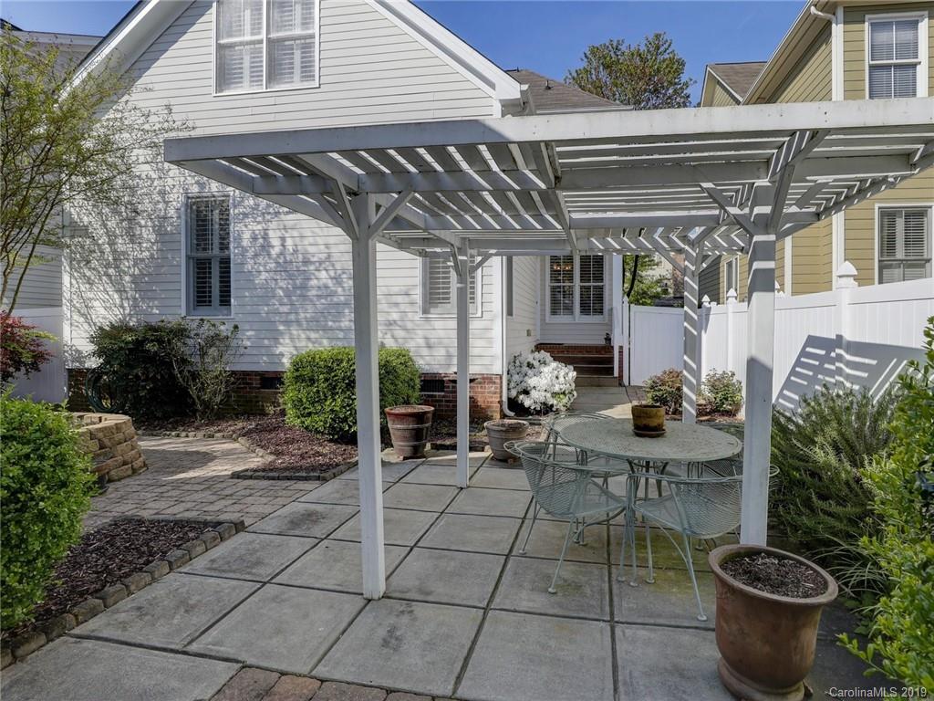 761 Shady Grove Crossing Fort Mill, SC 29708 - Photo 32 of 48 a view of a patio with table and chairs and potted plants