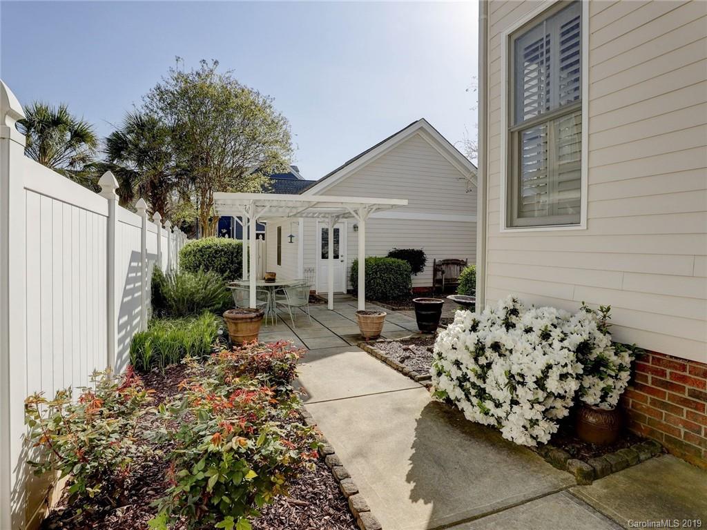 761 Shady Grove Crossing Fort Mill, SC 29708 - Photo 5 of 48 a view of a backyard with furniture potted plants and wooden fence