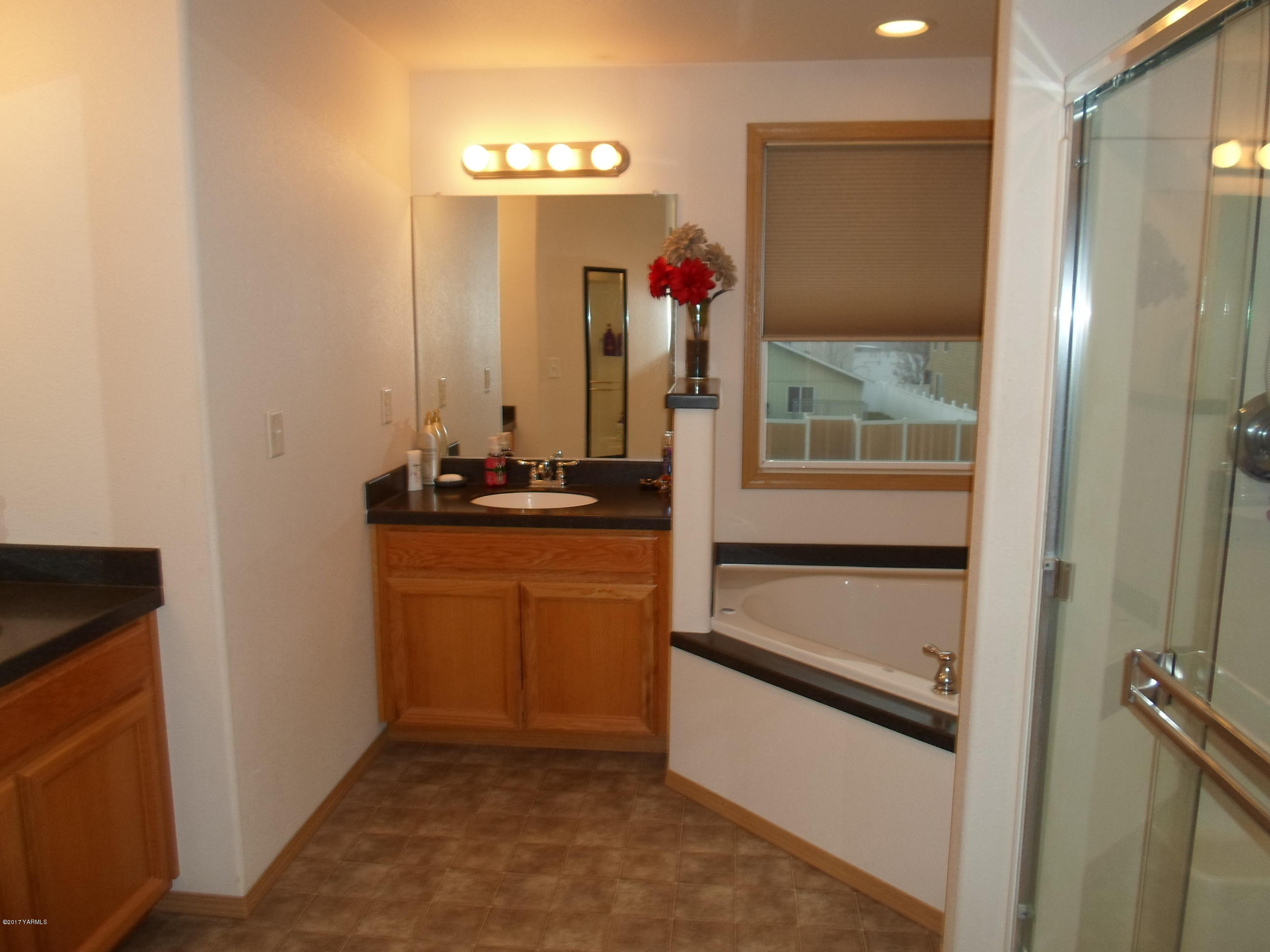 206 South Zeus Street Moxee, WA 98936 - Photo 11 of 22 a kitchen with stainless steel appliances granite countertop a refrigerator and a sink