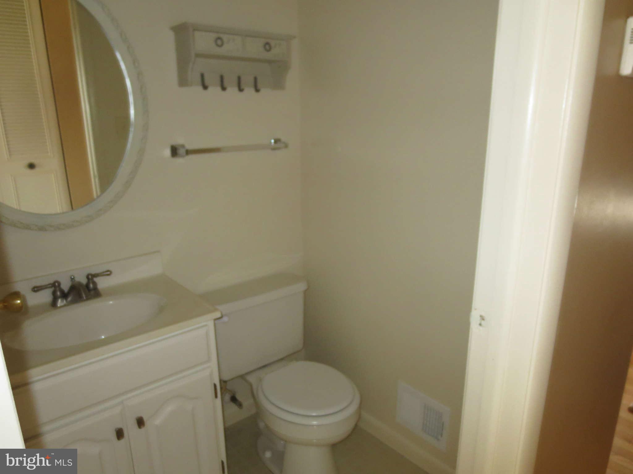 17609 Kohlhoss Road Poolesville, MD 20837 - Photo 3 of 8 a bathroom with a sink and a toilet