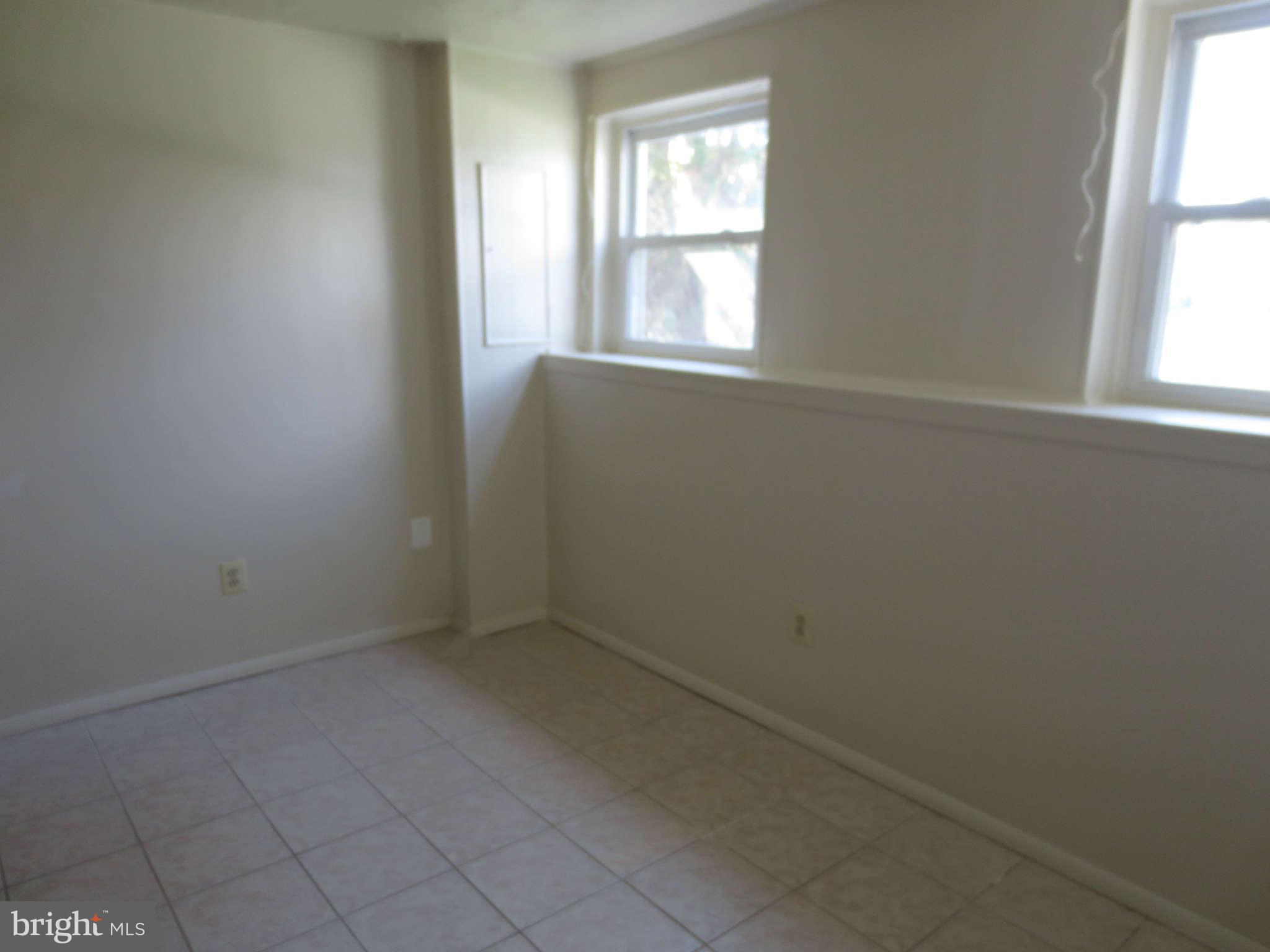 17609 Kohlhoss Road Poolesville, MD 20837 - Photo 6 of 8 an empty room with windows