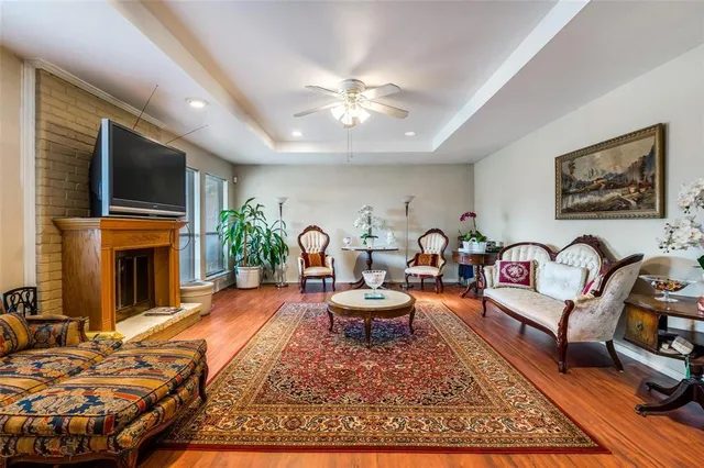 a living room with fireplace furniture and a flat screen tv