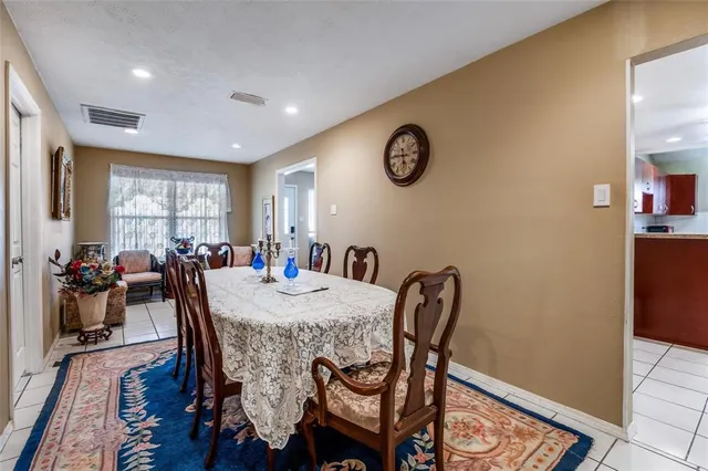 a view of a dining room with furniture and window